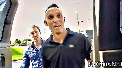 Two men in casual shirts stand by open van door in Bang Bus style pickup scene