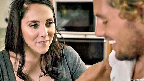 Nickey Huntsman smiling with partner in casual kitchen scene, adult video thumbnail