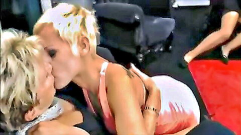 Blonde mature and young lesbians passionately kissing in pink dress