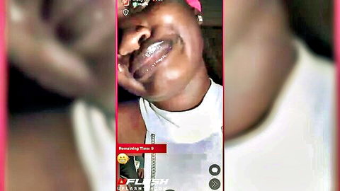 Ebony woman smiling with gold grillz on TikTok live video