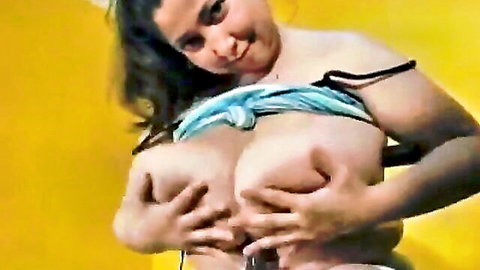 Diana's huge tits exposed, smiling topless on exercise bike