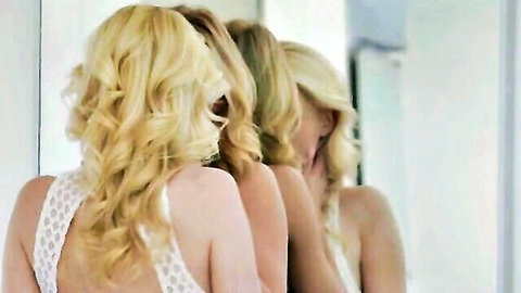 Three blonde women in white lace lingerie admiring each other