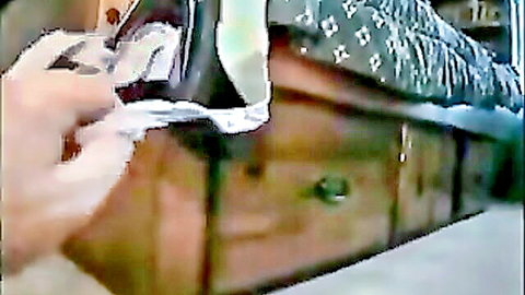 Hairy anal scene with woman on bed, post-action cleanup