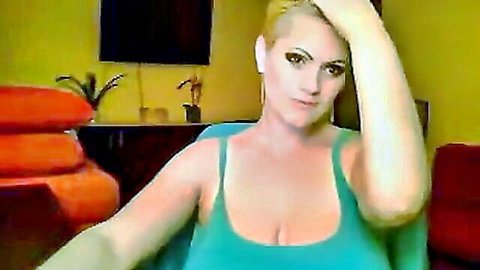 Busty blonde MILF teases huge tits cleavage in tight tank top