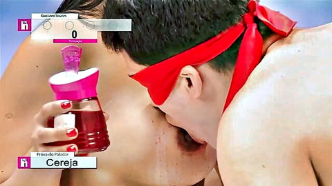 Blindfolded tanned hunk swallows thick red cherry liquid poured from pink bottle into open mouth