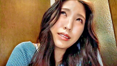 Sexy Asian brunette gazing up with wide eyes and parted lips craving cock