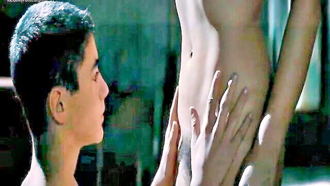 Young man caressing Malena's bare midriff in intimate close-up scene from Malena (2000)