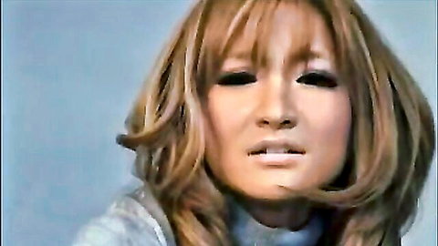 Japanese woman with long wavy brown hair and smoky eyes in ballbusting footjob preview
