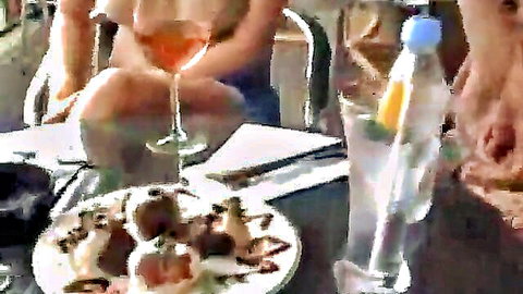 Taylor topless in We Live Together, relaxing with rosé and snacks