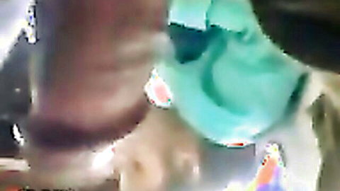 Blurry close-up of girl giving blowjob while staring at camera in secret