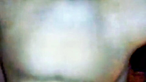 Blonde MILF with massive cleavage in tight white top, face in ecstasy during orgasm