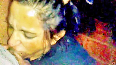 Gray-haired mature woman eagerly sucking cock in intense close-up blowjob