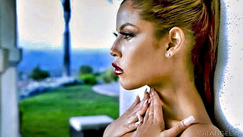 Bridgette B seductive side profile, hand on neck, blonde ponytail outdoors