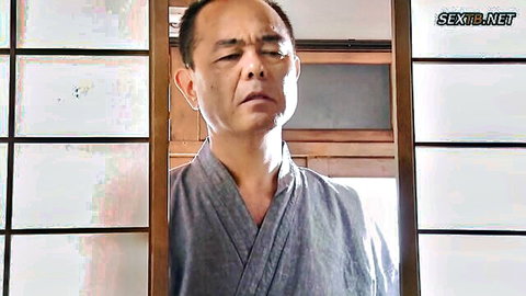 Japanese man in traditional attire looking melancholic in JAV wife scenario