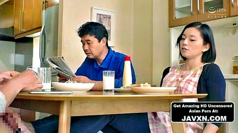 Asian woman in checkered apron with man at breakfast table, JAV taboo scene