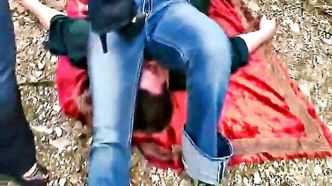 Amateur woman facesitting on man's face outdoors with jeans pulled to ankles on red rug