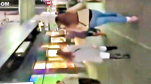Voyeur street shot of big ass girl in tight jeans bent over bar exposing bare cheeks