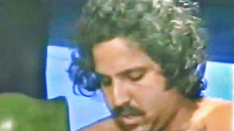 Vintage Ron Jeremy shirtless with curly hair and mustache