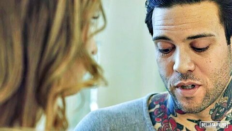 Kristen Scott in intimate close-up with tattooed man