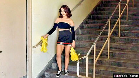 Isabella Nice as sexy teen cheerleader posing with pom poms on stairs