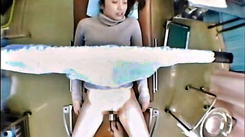 Japanese woman in gyno chair legs spread getting pussy penetrated by doctor