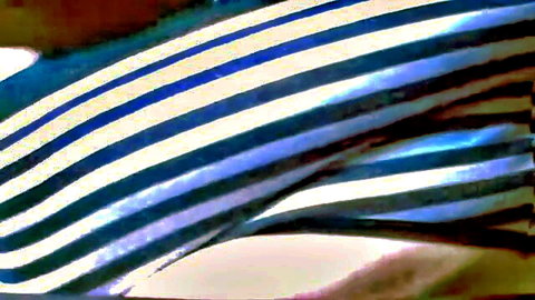 Curvy fat woman in striped towel after shower, close-up view