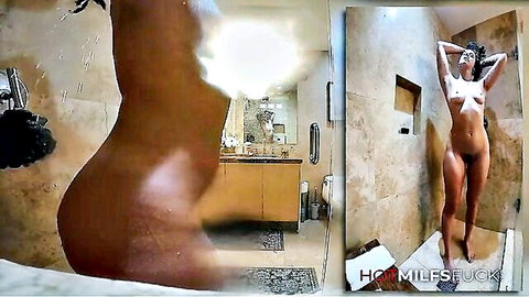 Skinny brunette MILF naked in shower flaunting wet ass and tits in mirror reflection