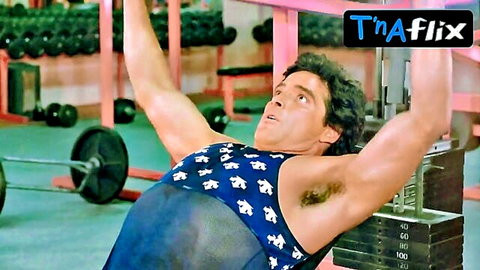 Hunky guy exposes hairy armpits in sheer blue tank top during gym pulldown workout