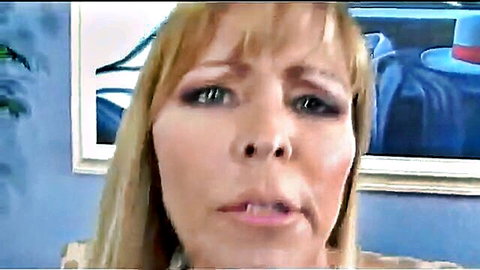 Blonde MILF closeup with wide eyes and open mouth in intense expression