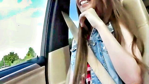 Smiling brunette amateur babe showing deep cleavage in car seatbelt