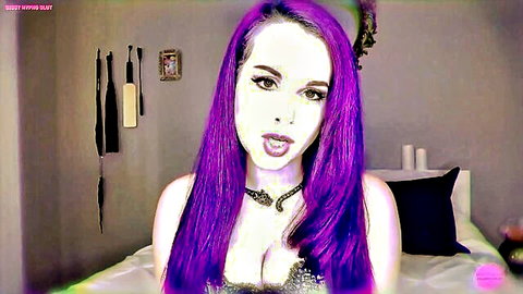 Purple-haired goth babe sticks out tongue, teasing in black lingerie cleavage