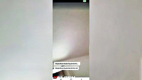 Blurry screenshot of single girl wants cumshot text on video call screen