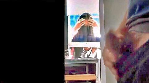 Blurry amateur woman covers face in bathroom mirror selfie wearing dark hoodie and sneakers