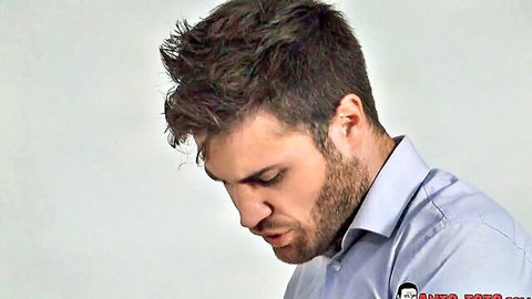 Bearded man in blue shirt with intense gaze, from Anais anal scene