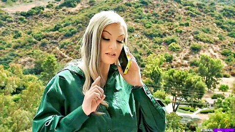 Blonde MILF in green jacket talking on phone outdoors