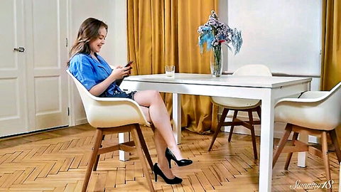 Kira Stone sexy teen in short skirt checking phone teasingly