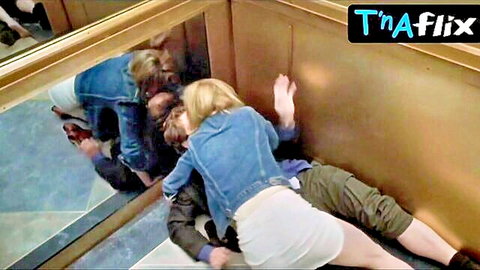 Melora Walters in underwear scene, blonde kissing man on floor in denim jacket and skirt
