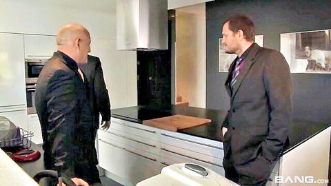 Two suited coworkers in kitchen before Jasmine Jae threesome action