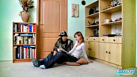 Slim white teen couple reading book on floor before anal fuck