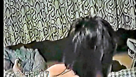 Young Asian teen bends over from behind exposing bare ass cheeks