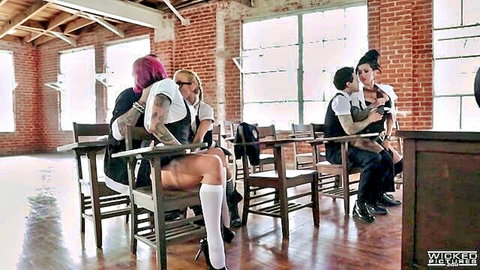 Anna Bell Peaks and MILFs in schoolgirl orgy, tattooed babes embracing at desks
