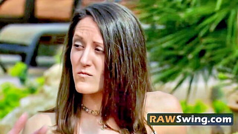 Brunette swinger wife pouts seductively outdoors showing cleavage in tight top