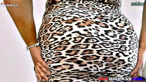 Dallas Playhouse in tight leopard print dress, showcasing her big ass from behind