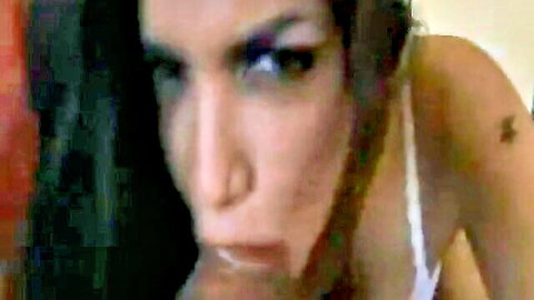 Intense close-up brunette giving POV blowjob in white lingerie