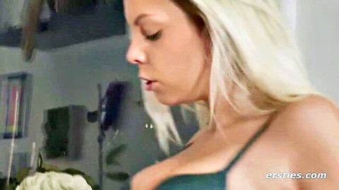 Blonde beauty in green lingerie teases with deep cleavage in lesbian passion scene