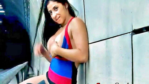 Gaby Succubus teasing cleavage in red blue top outdoors