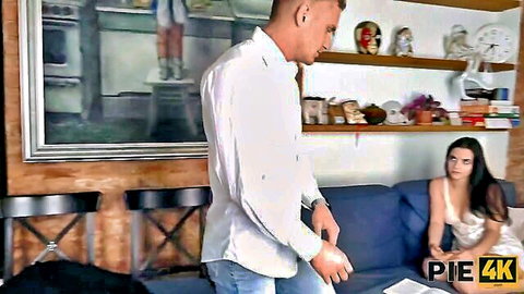 Brunette teen girlfriend on couch seduces standing man in white shirt ready to fuck